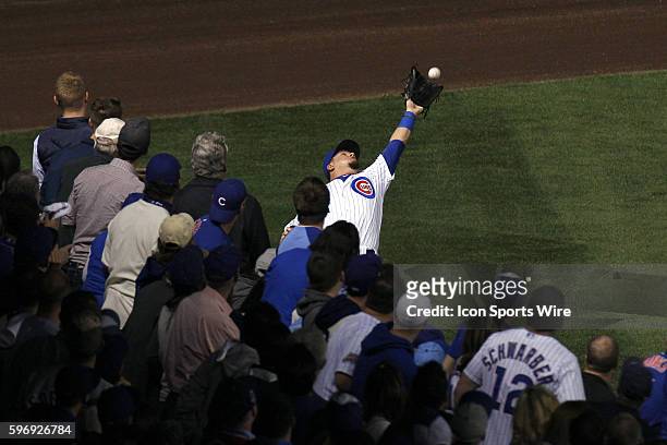 Chicago Cubs left fielder Kyle Schwarber catches a fly ball hit by New York Mets first baseman Lucas Duda in the first inning of game 3 action of the...