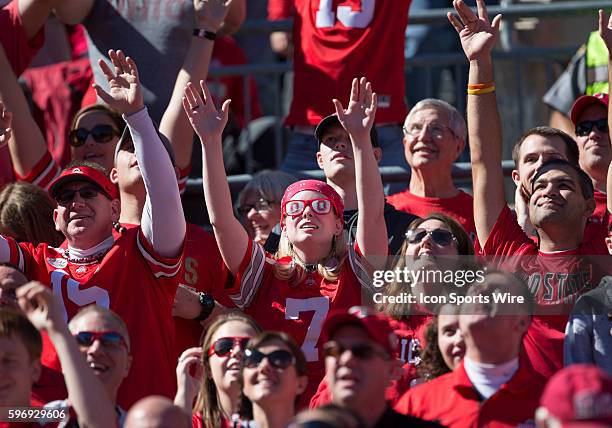 Ohio State Buckeye fans show their spirit during the game between the Ohio State Buckeyes and the University of Maryland Terrapins at the Ohio...