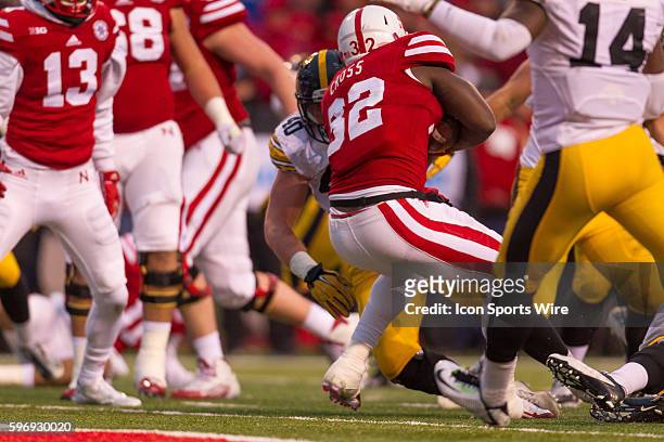 Imani Cross of the Nebraska Cornhuskers backs his way in for his second touchdown against the Iowa Hawkeyes in the third quarter at Memorial Stadium...