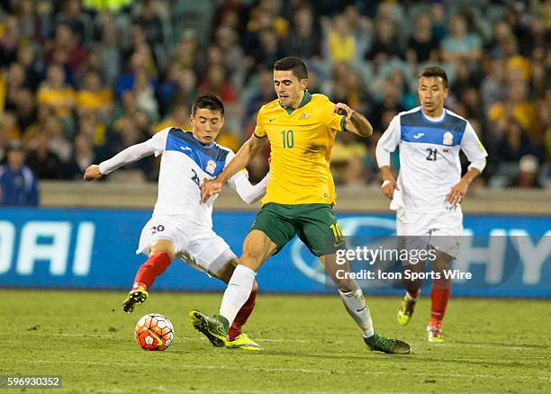 Tomas Rogic of Australia keeps the ball away from Duishebekov Bahtiyar of Kyrgyzstan during the second half of the Asia Group FIFA 2018 World Cup...