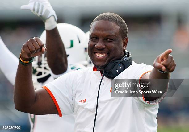 Miami Hurricanes head coach Larry Scott reacts after a touchdown during the first half in the NCAA Football game between Miami Hurricanes and...