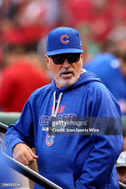 Chicago Cubs manager Joe Maddon stands on the dugout steps during game two of baseball's National League Division Series against the St. Louis...