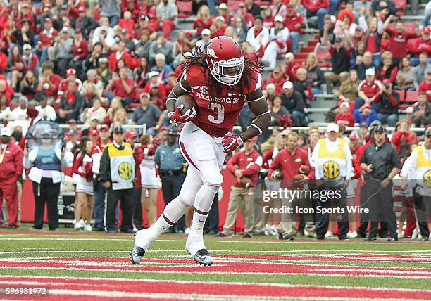Arkansas Razorbacks running back Alex Collins scores a touchdown during an NCAA football game between the Arkansas Razorbacks and the University of...
