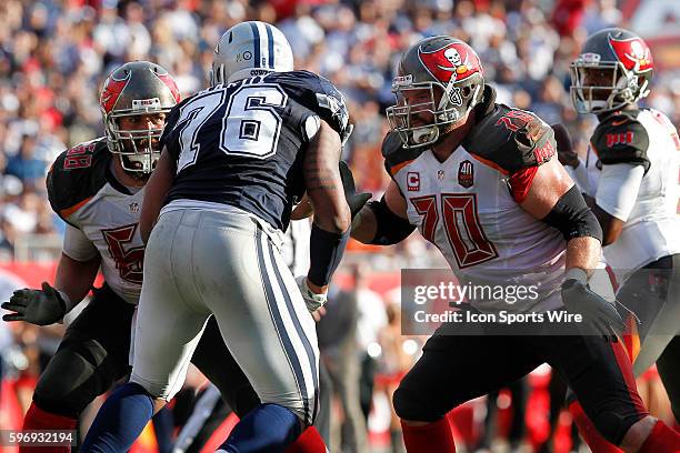 Tampa Bay Buccaneers center Joe Hawley an Tampa Bay Buccaneers guard Logan Mankins block Dallas Cowboys defensive end Greg Hardy during the NFL game...