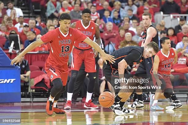 Fresno State Bulldogs forward Cullen Russo steals the ball from University of Pacific Tigers guard Aaron Hendricks during the Fresno State Bulldogs...