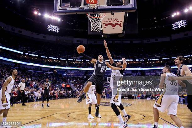 San Antonio Spurs guard Ray McCallum drives to the basket against New Orleans Pelicans forward Anthony Davis during the game between San Antonio...