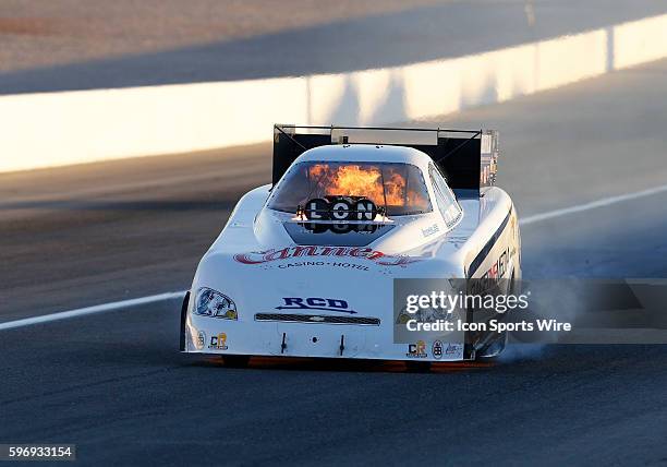 Tim Gibbons NHRA Funny Car rolls down the track in flames during the Toyota NHRA Nationals at The Strip at Las Vegas Motor Speedway in Las Vegas,...