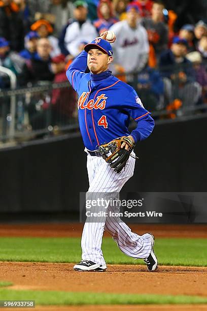 New York Mets shortstop Wilmer Flores throws the ball to first base after making a play during Game 1 of the National League Championship Series...