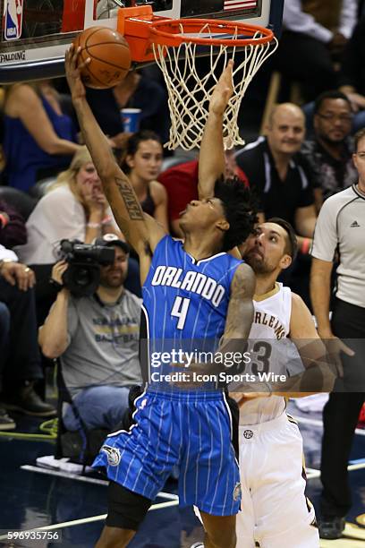 Orlando Magic guard Elfrid Payton shoots an underhand shot in front of New Orleans Pelicans forward Ryan Anderson during the game between Orlando...