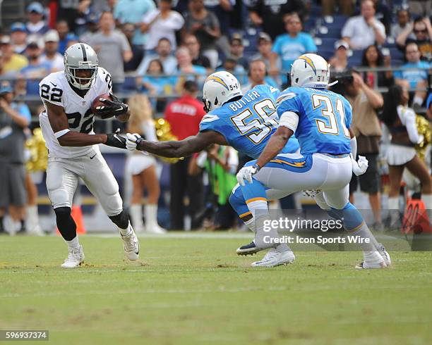 October 25, 2015 - Oakland Raiders Running Back Taiwan Jones [16203] makes move around San Diego Chargers Linebacker Donald Butler [9855] and San...