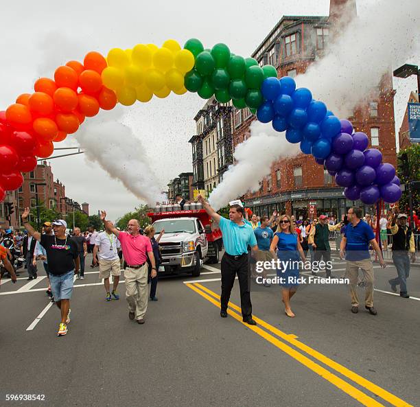 Boston Mayor Marty Walsh and MA Governor Deval Patrick cut the ribbon to open the Boston Pride Parade on June 14, 2014. Lorrie Higgins, Mayor Walsh's...