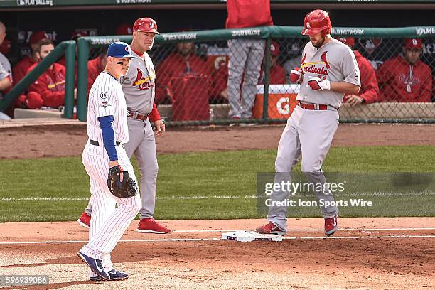 John Lackey tags first base after beating out broken bat single while playing in game 4, of the NLDS, in a game between the St Louis Cardinals, and...