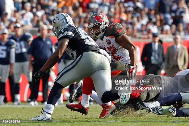 Tampa Bay Buccaneers running back Doug Martin runs the ball toward Dallas Cowboys middle linebacker Anthony Hitchens during the NFL game between the...