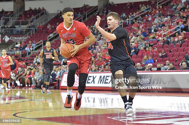 Fresno State Bulldogs forward Cullen Russo goes into the paint as University of Pacific Tigers guard Aaron Hendricks defends during the Fresno State...