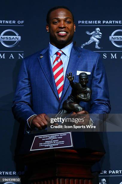 University of Alabama running back Derrick Henry poses with the Heisman Trophy at a press conference after the 81st Annual Heisman award ceremony in...