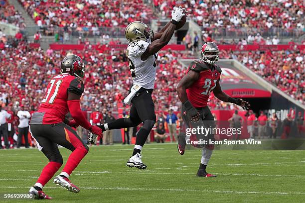 New Orleans Saints tight end Benjamin Watson catches a pass in-between Tampa Bay Buccaneers strong safety Major Wright and Tampa Bay Buccaneers...