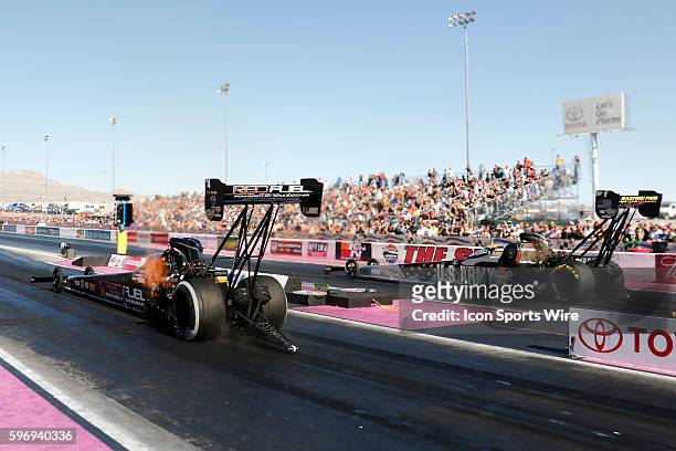 Shawn Langdon Al-Anabi Racing NHRA Top Fuel Dragster goes up against Tony Schumacher DSR Army NHRA Top Fuel Dragster in round three during the 15th...