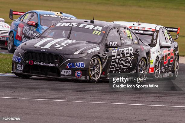Andre Heimgartner of Super Black Racing and James Courtney of the Holden Racing Team during Race 1 for the V8 Supercars WD-40 Philip Island...