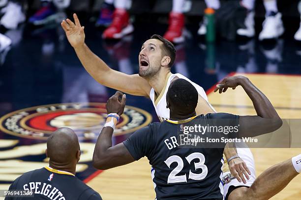 New Orleans Pelicans forward Ryan Anderson is fouled by Golden State Warriors forward Draymond Green during the game between Golden State Warriors...