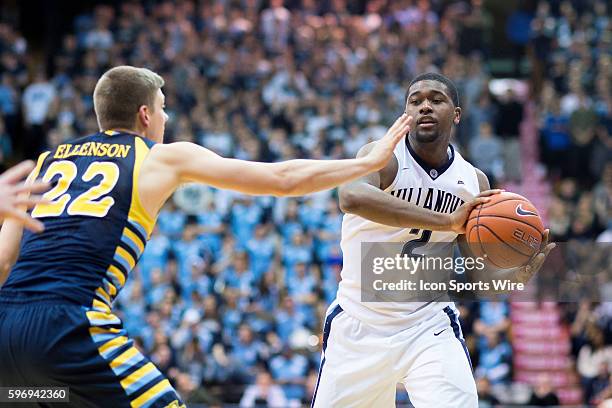 Villanova Wildcats forward Kris Jenkins passes around Marquette Golden Eagles guard Wally Ellenson during the NCAA Men's basketball game between the...