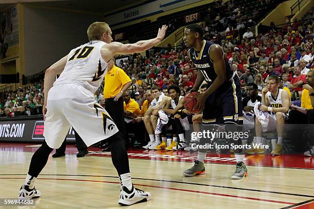 Notre Dame Fighting Irish guard Demetrius Jackson is defended by Iowa Hawkeyes guard Mike Gesell during the 2015 Advocare Invitational consolation...