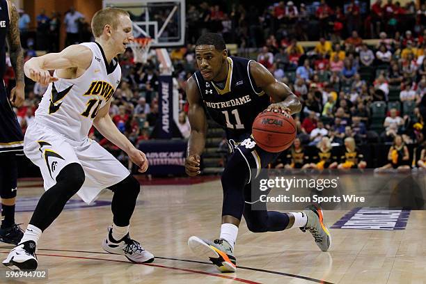 Notre Dame Fighting Irish guard Demetrius Jackson is defended by Iowa Hawkeyes guard Mike Gesell during the 2015 Advocare Invitational consolation...