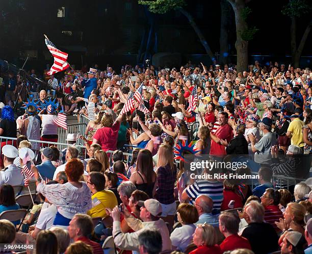 The Boston Pops orchestra performing with the US Navy Sea Chanters at the Hatch Shell on the Charles River Esplanade during the dress rehearsal for...