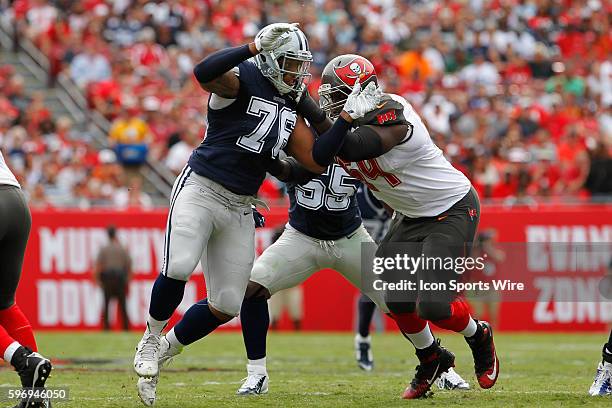 Dallas Cowboys defensive end Greg Hardy is blocked by Tampa Bay Buccaneers offensive guard Kevin Pamphile during the NFL game between the Dallas...