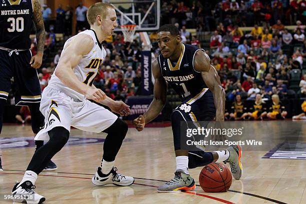 Notre Dame Fighting Irish guard Demetrius Jackson is defended by Iowa Hawkeyes guard Mike Gesell during the 2015 Advocare Invitational consolation...