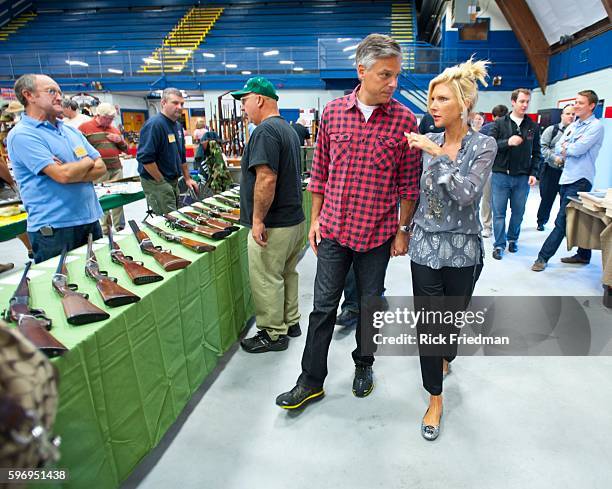 Republican presidential candidate and former Utah Governor Jon Huntsman campaigning with his wife Mary Kaye Huntsman at a gun show in Concord, NH on...