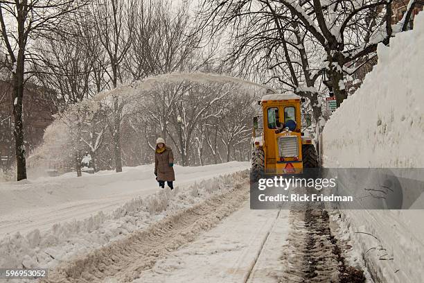 Large snow blower removing snow on Commonwealth Avenue in Boston, MA, where over 7 feet of snow has fallen in past 3 weeks on February 15, 2015.