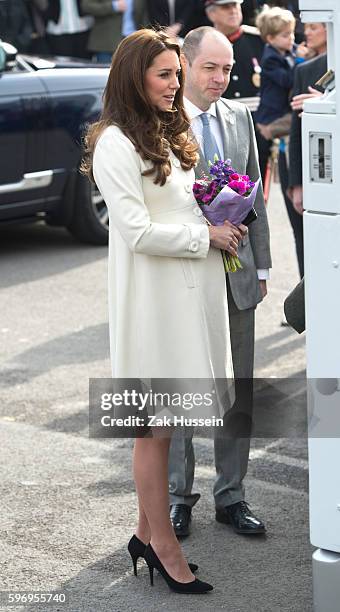 Catherine, Duchess of Cambridge, wearing a cream Jojo Maman Bebe maternity coat, visits cast and crew of Downton Abbey at Ealing Studios in London.