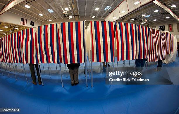 Voting the NH primary at Bedford High School in Bedford, NH on January 10, 2012.