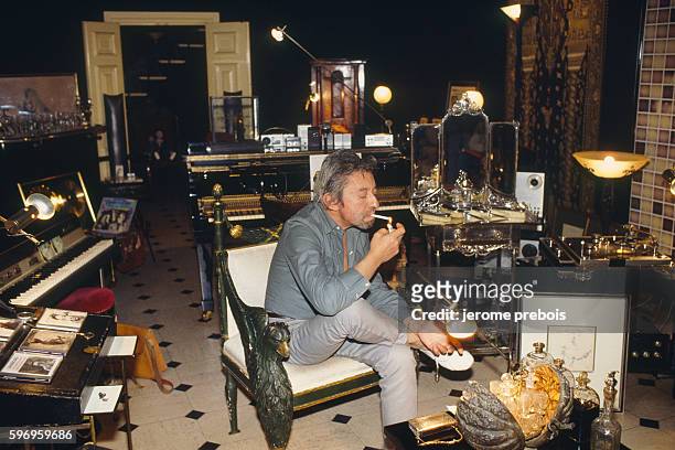French actor, singer and songwriter Serge Gainsbourg at home at rue de Verneuil.