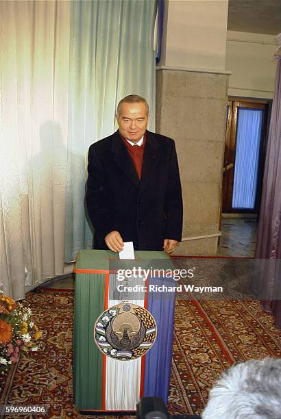 Candidate Islam Karimov votes for his own succession.