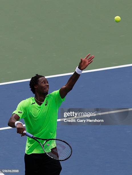 Gael Monfils of France serves to Grigor Dimitrov of Bulgaria in their match at the US Open tennis championship in New York, September 2, 2014.