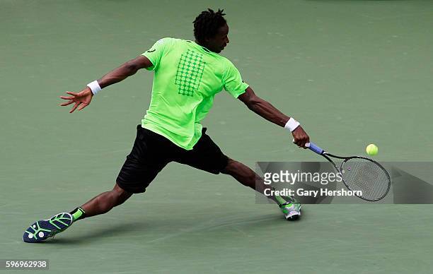 Gael Monfils of France hits to Grigor Dimitrov of Bulgaria in their match at the US Open tennis championship in New York, September 2, 2014.