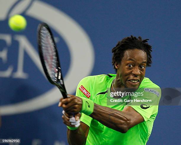 Gael Monfils of France hits to Roger Federer of Switzerland during their match at the US Open in New York, September 4, 2014.