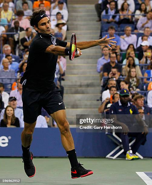 Roger Federer of Switzerland hits to Gael Monfils of France during their match at the US Open in New York, September 4, 2014.