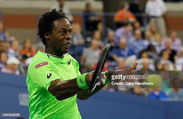 Gael Monfils of France hits to Roger Federer of Switzerland during their match at the US Open in New York, September 3, 2014.