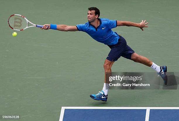 Grigor Dimitrov of Bulgaria hits to Gael Monfils of France in their match at the US Open tennis championship in New York, September 2, 2014.