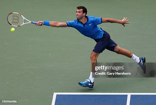 Grigor Dimitrov of Bulgaria hits to Gael Monfils of France in their match at the US Open tennis championship in New York, September 2, 2014.