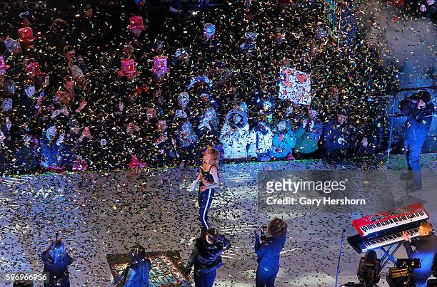 Singer Taylor Swift is showered in confetti as she perforns in Times Square during New Year's Eve festivities in New York, December 31, 2014.