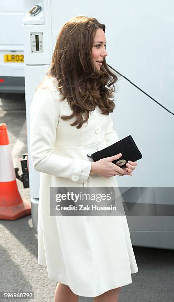 Catherine, Duchess of Cambridge, wearing a cream Jojo Maman Bebe maternity coat, visits cast and crew of Downton Abbey at Ealing Studios in London.