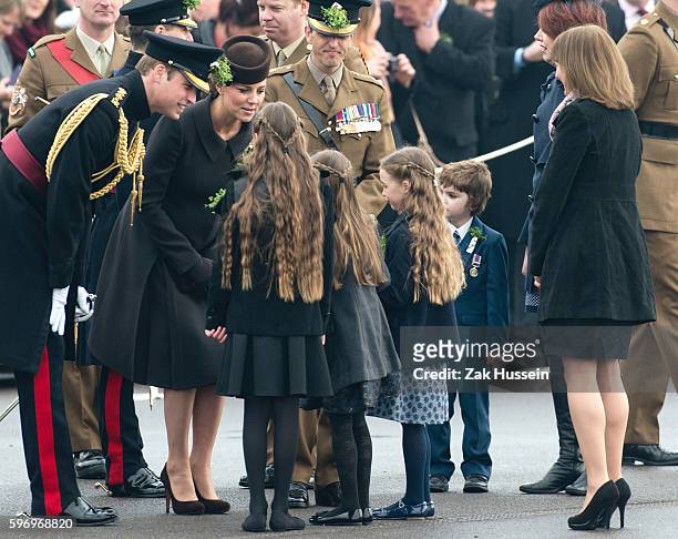 Prince William, Duke of Cambridge and Catherine, Duchess of Cambridge, wearing a bespoke Catherine Walker coat, attending the Irish Guards' St....