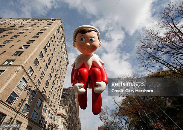 The Elf on the Shelf balloon floats down Central Park West in the Macy's Thanksgiving Day Parade in New York, November 26, 2015.