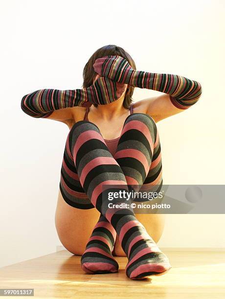 woman dressed in striped stockings - seamed stockings stock pictures, royalty-free photos & images