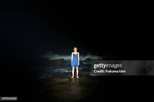 standing woman - sadness concept stock pictures, royalty-free photos & images