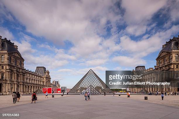 the louvre museum in paris, france. - louvre pyramid stock pictures, royalty-free photos & images