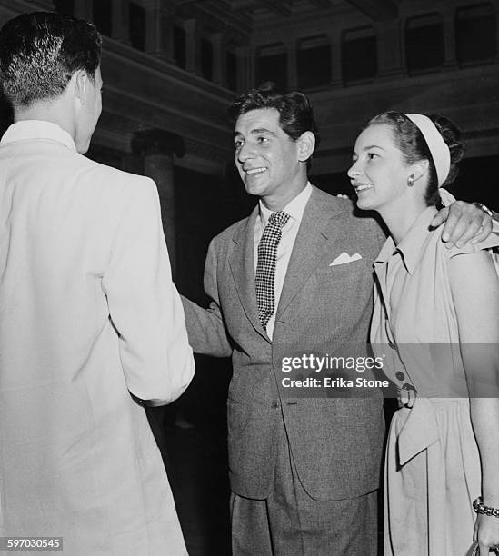 American composer and conductor Leonard Bernstein with his fiancee, actress Felicia Montealegre and a student at Tanglewood, the Boston Symphony...